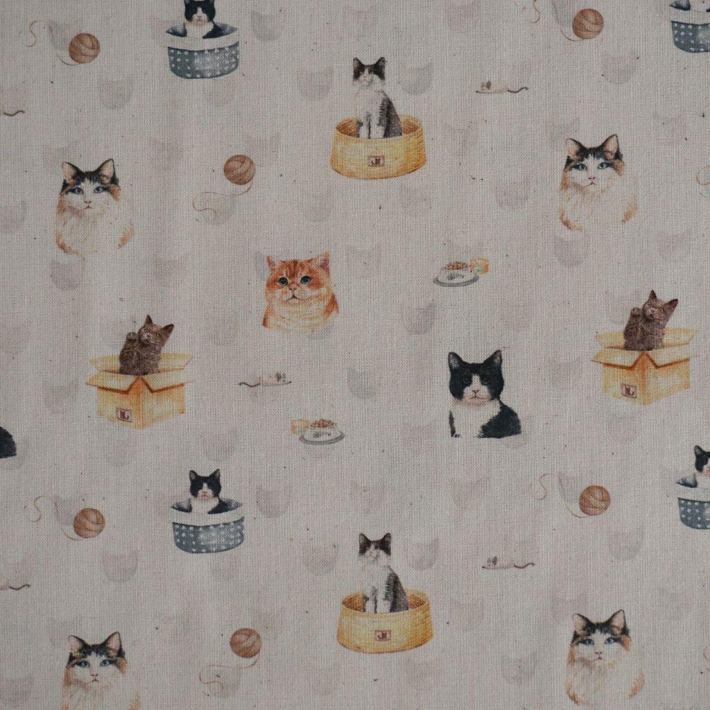 Baumwollstoff Motivdruck Katzenköpfe Katzensachen hell
